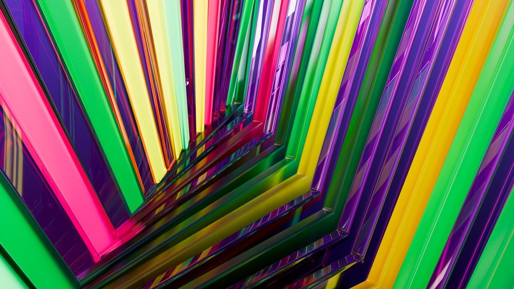 Colorful geometric pattern with vivid pink, green, yellow, and purple stripes and reflective shiny surfaces forming a symmetrical abstract design.