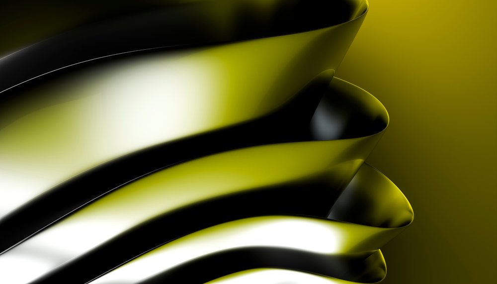 Close-up of smooth curved metallic shapes with a shiny black and yellow gradient finish.
