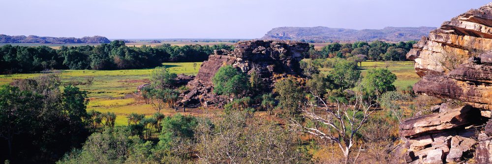 Rock formations amid trees and open plains in Kakadu National Park, Northern Territory, Kakadu National Park Northern Territory, Australia.