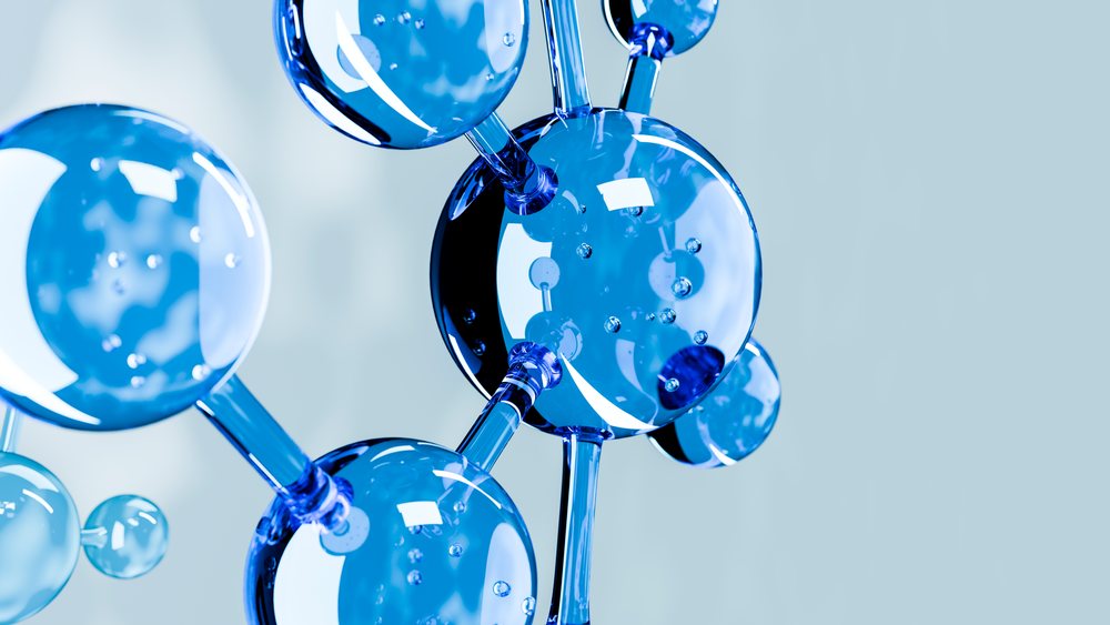 3D rendered blue molecular structure showing atoms as connected spheres and chemical bonds.