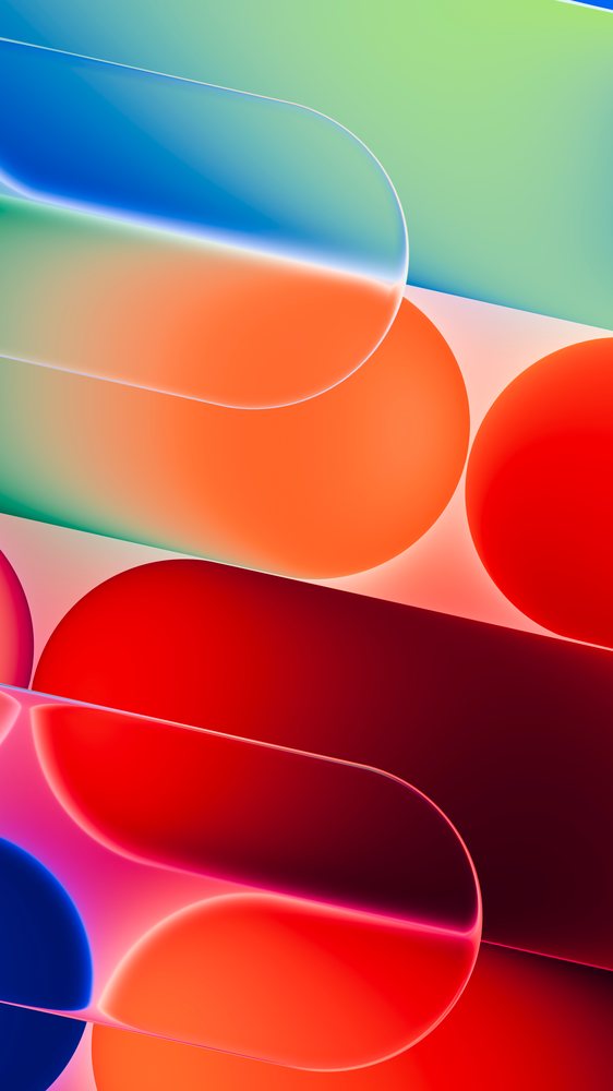 Abstract arrangement of colorful translucent pill-shaped medicine capsules overlapping on a soft gradient background.