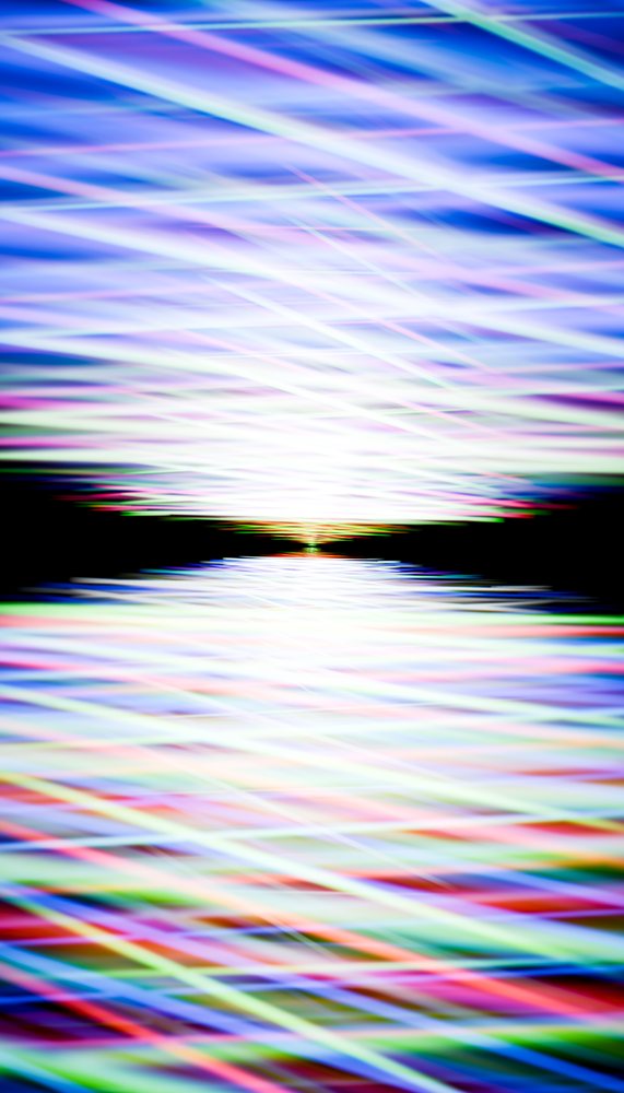 Abstract digital artwork showing colorful light streaks and reflections forming dynamic wave patterns.
