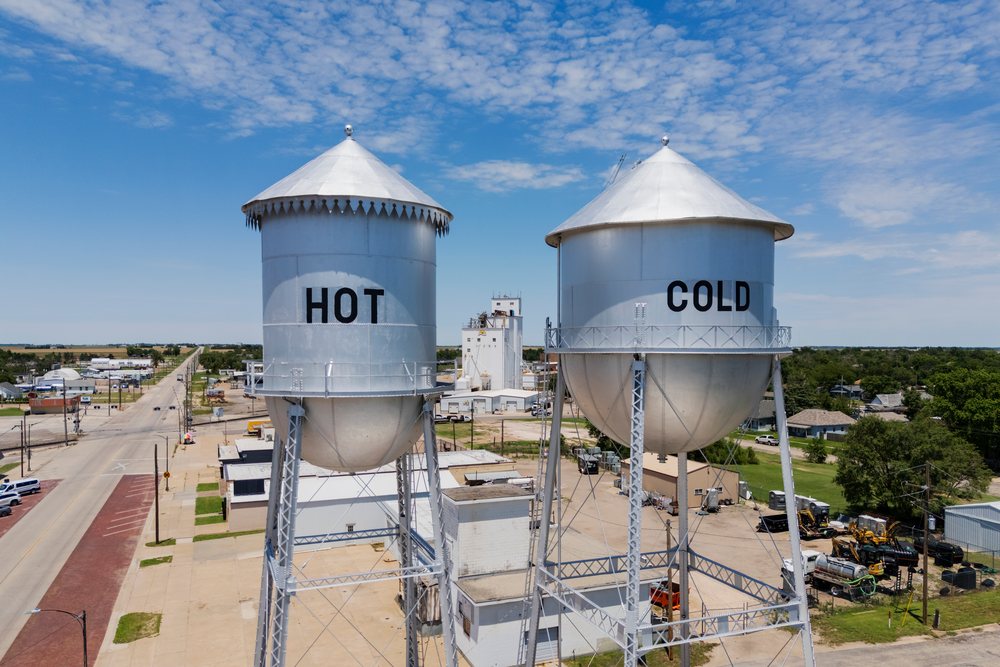 Two large metal Water Towers labeled "Hot" and "Cold" stand near North Main Street, a quirky roadside landmark since 1956, Weather, Environmental Issues, Storm Chasing, Pratt, Kansas, USA.