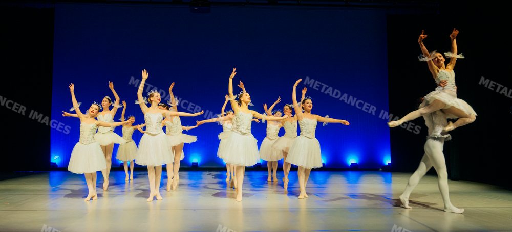 Ballet dancers performing a holiday-themed ballet on stage
