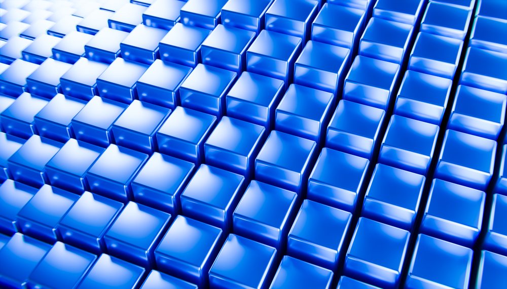 Blue glossy 3D cubes with reflective surfaces arranged in uniform rows forming a repeating geometric pattern on a blue background, abstract render background.
