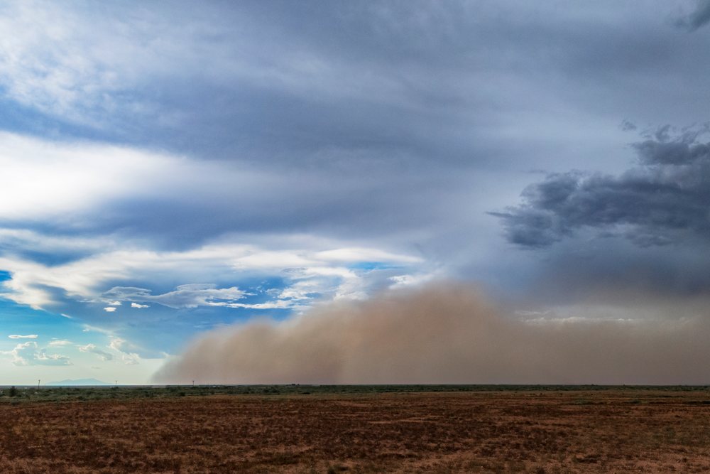Haboob Dust Storm advances across dry landscape, USA under a cloudy sky, Storm Chasing, Weather, Environmental Issues, Rodeo, Arizona.