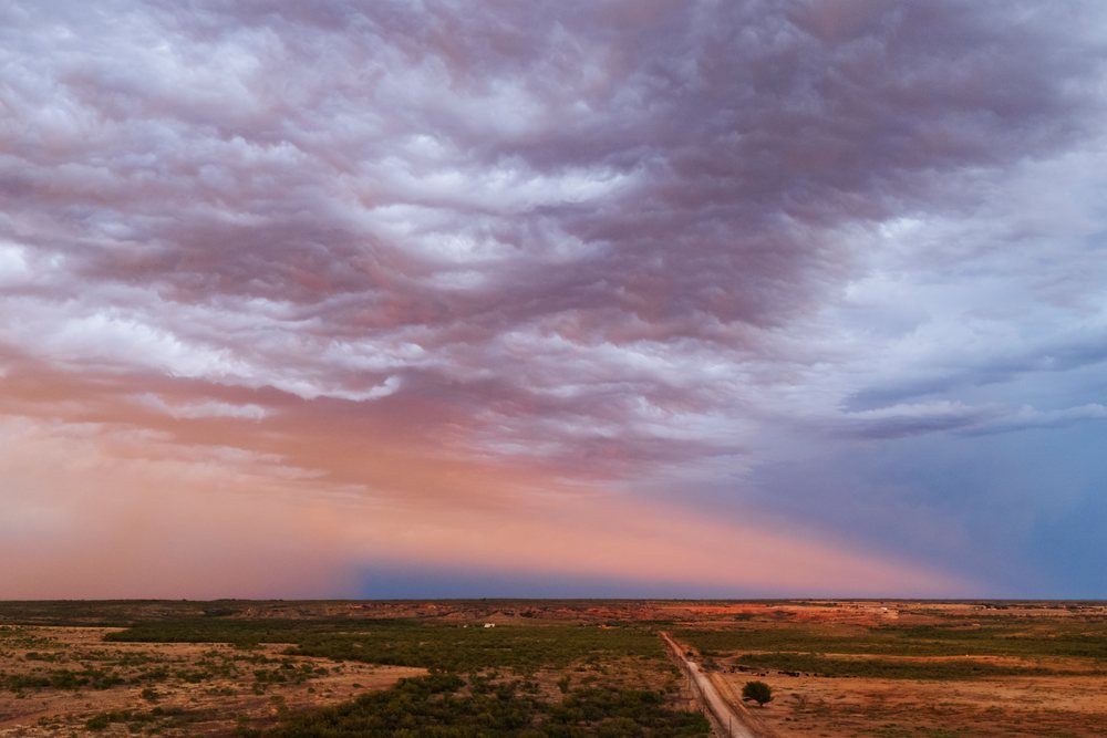 Anti-crepuscular ray at Sunset with dramatic clouds over a flat rural landscape, Storm Chasing, Weather, Environment, Post, Texas, USA.
