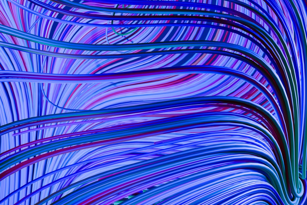 Abstract digital art features colorful curved blue, purple, and red lines forming a dynamic flowing wave pattern.