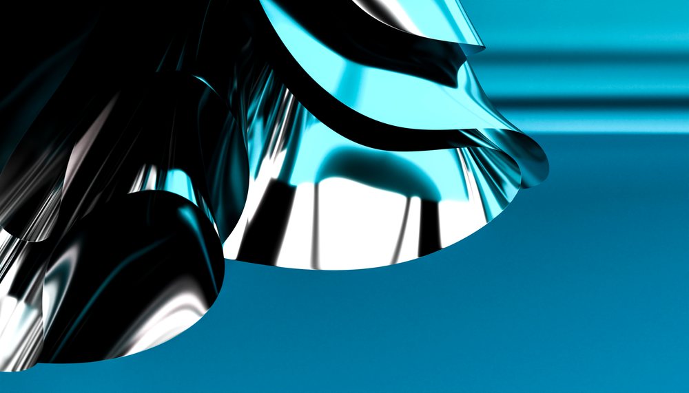 Shiny curved metal foil with reflective blue and silver surface against a blue background.