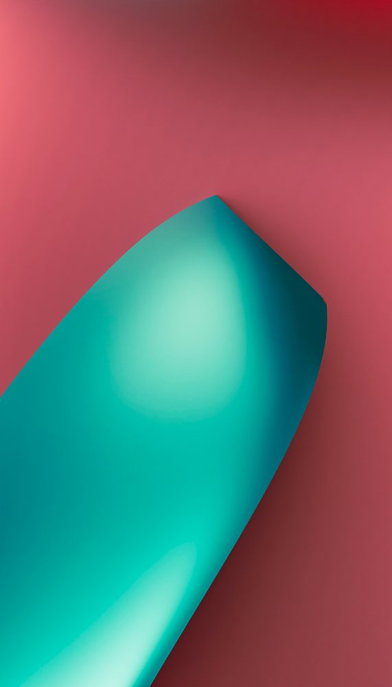 A blue sheet of curled paper on a red gradient background creates an abstract and minimalistic composition.