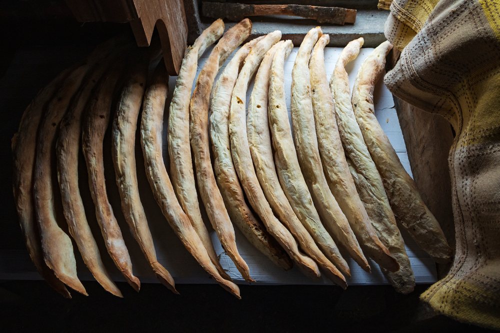 Georgian Lavash bread drying on a wooden surface, Culture, Badiauri, Georgia.