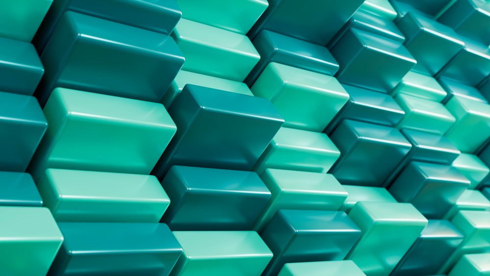 Pattern of three-dimensional blue and turquoise blocks stacked in a geometric arrangement forms a modern abstract digital background.