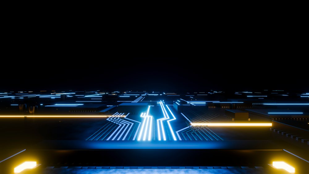 Close-up of a glowing blue circuit board illuminated with electronic components and yellow edge lights on a dark background.