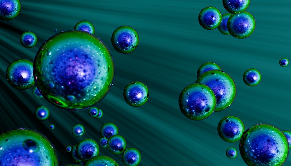 Blue and green shiny spherical orbs floating against a dark abstract background in digital 3D art.