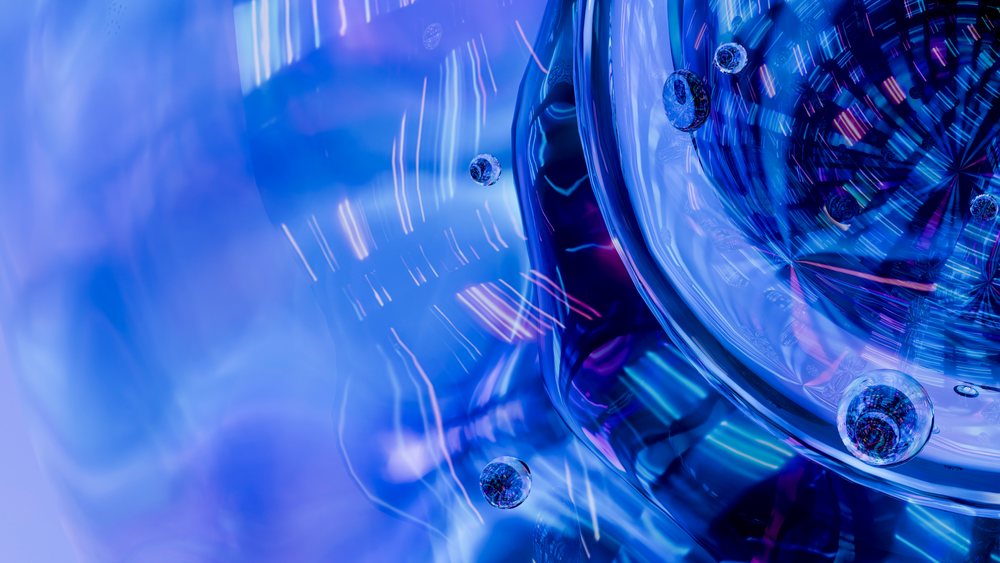 Abstract close-up of blue glass bubbles and light reflections creating a dynamic liquid surface texture.
