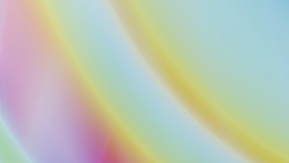 Gradient background with soft pastel colors blending smoothly in an abstract light transition.