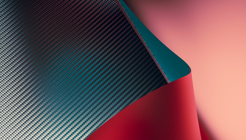 Close-up view of curled fabric showing intricate weave and contrasting colors.