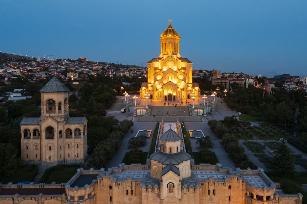 Holy Trinity Cathedral of Tbilisi (Sameba Cathedral) illuminated at Dusk with city skyline in the background, Skylines, Georgia.