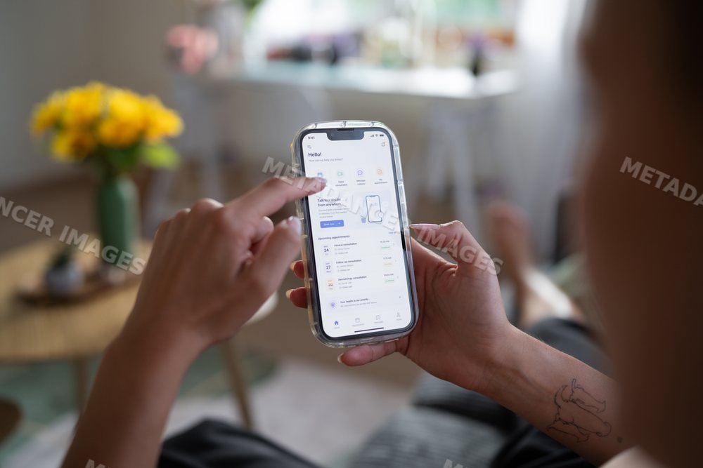 White Person using remote healthcare app on smartphone working
