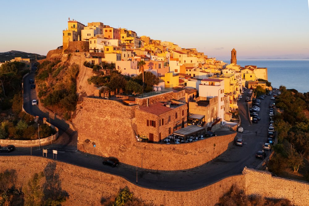 Villages of Castelsardo on a hilltop with stone walls overlooking the sea at Sunrise, Travel Images, Sardinia, Italy.
