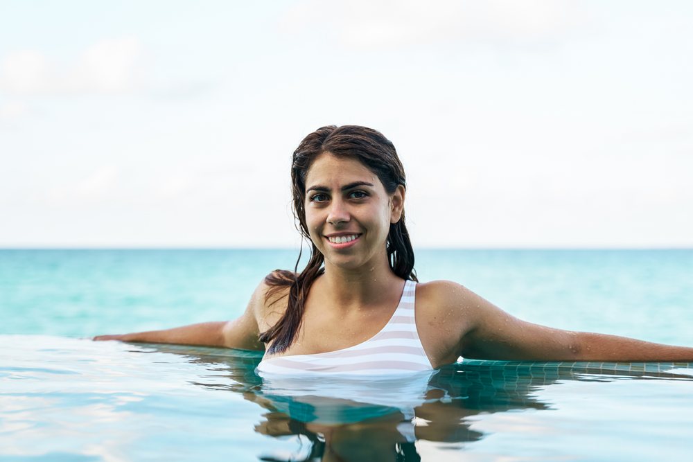A young white woman enjoys relaxing