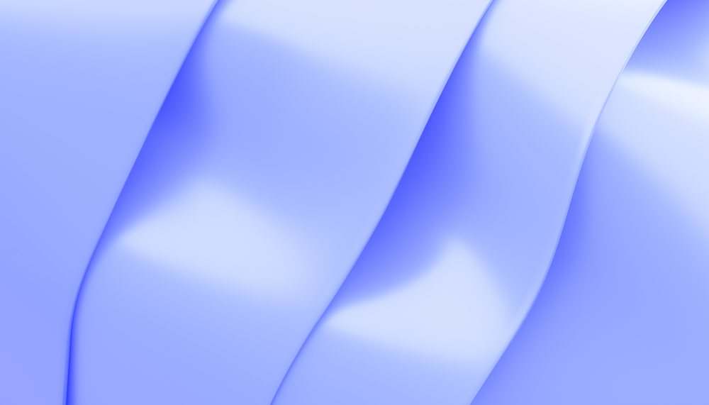 Abstract digital rendering of smooth blue curved shapes forming a fluid modern background design.