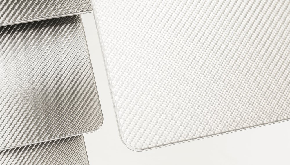 Close-up of white woven fabric showing detailed textile pattern and interlaced threads.