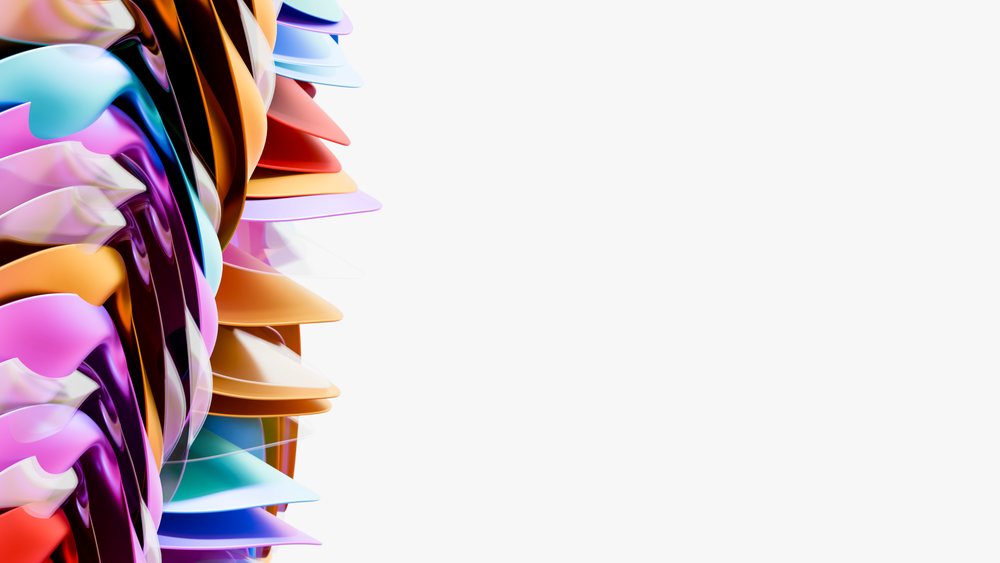 Colorful abstract sculpture featuring curved layers of plastic against a white background.