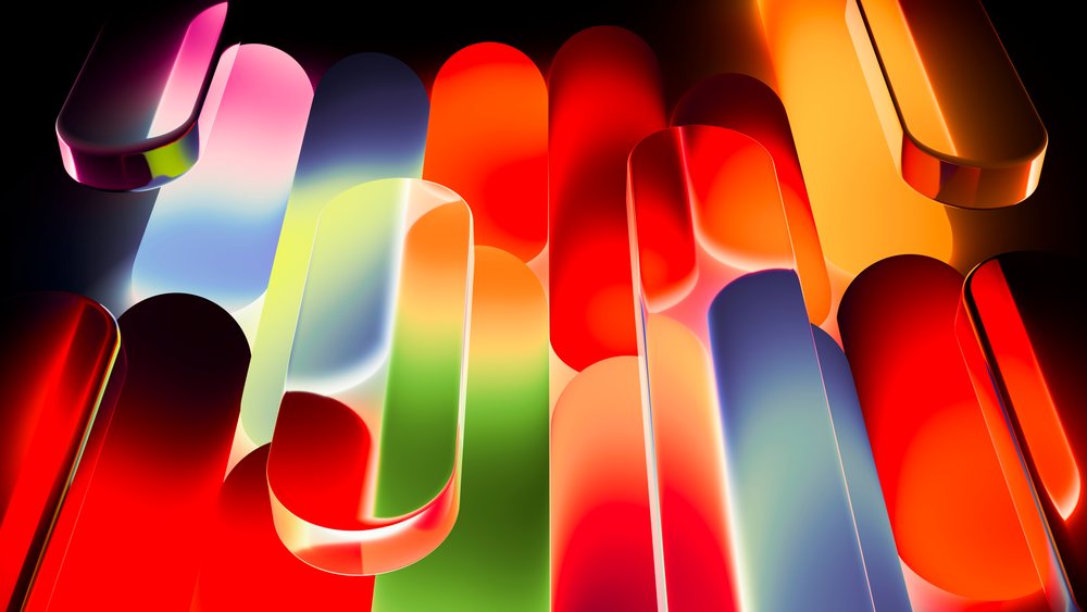Colorful glowing abstract glass shapes with smooth surfaces and light reflections in a modern digital 3D illustration.