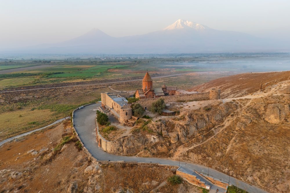 Khor Virap Monastery sits atop a rocky hill overlooking the Ararat plain with Mount Ararat visible in the background, Lusarat, Ararat Province, Armenia.