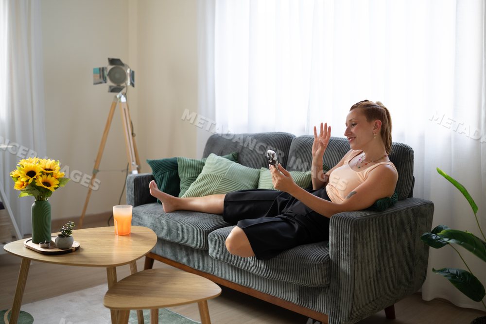 White Woman waving during a video call