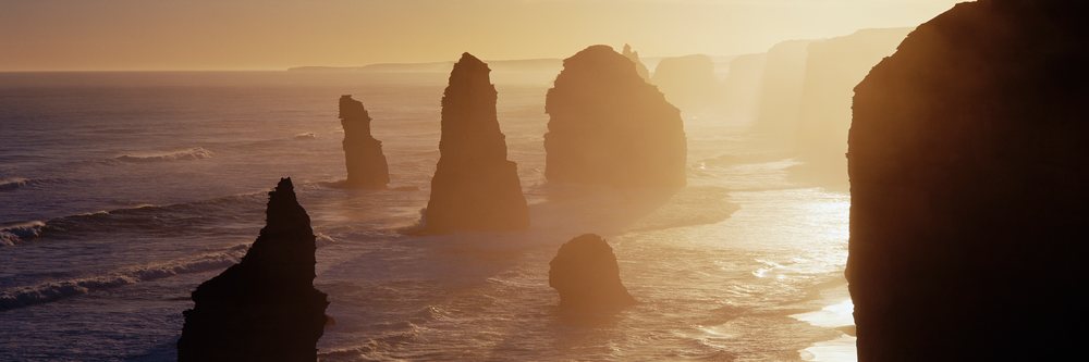 The Twelve Apostles rock formations rise from the ocean along the coastline at Port Campbell National Park, Twelve Apostles Port Campbell National Park Victoria, Australia.
