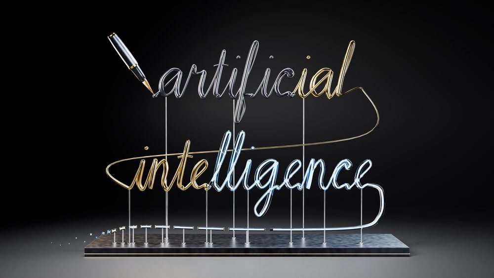 Wire sculpture spelling out artificial intelligence in cursive script mounted on a stand with a pen positioned as if writing on a black background.