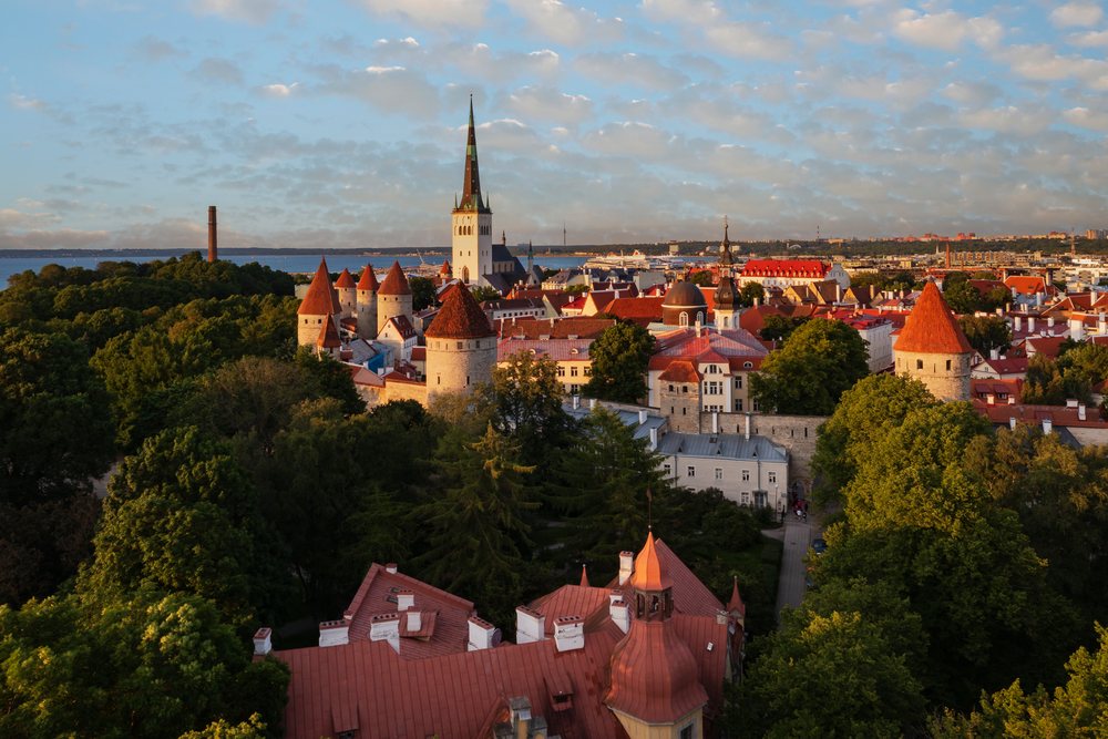 Tallinn Skyline with historic towers, red rooftops, and church steeple at Sunset in the coastal Baltic city of, cityscape, Estonia, Baltic States.
