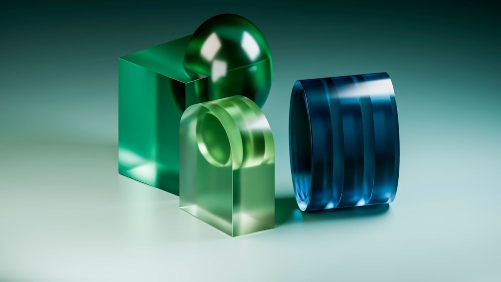 3D illustration featuring transparent green and blue geometric glass shapes on a reflective surface under gradient lighting.