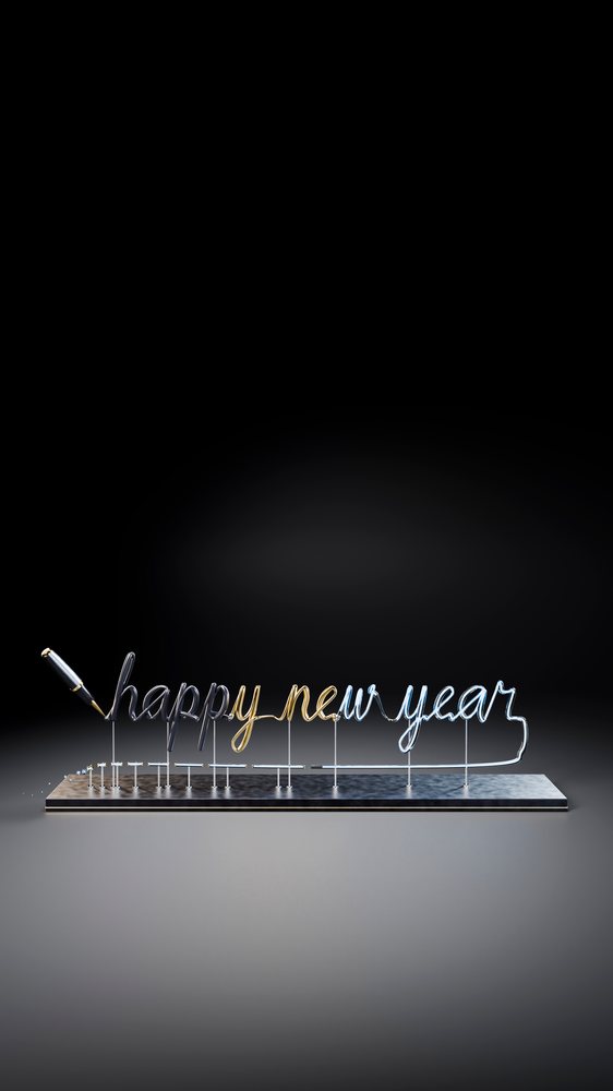 Wire formed into cursive 'happy new year' phrase attached to a pen on a metal stand against a black background.