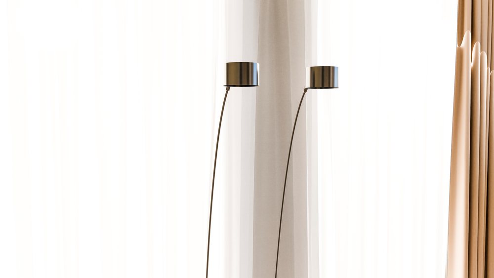 Two modern metal floor lamps with shades stand indoors in front of sheer white and beige curtains.