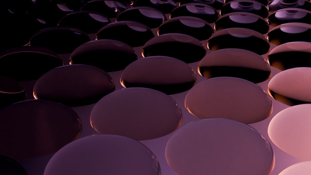 Close-up illustration showing purple water droplets on a smooth, shiny surface demonstrating surface tension and reflection.