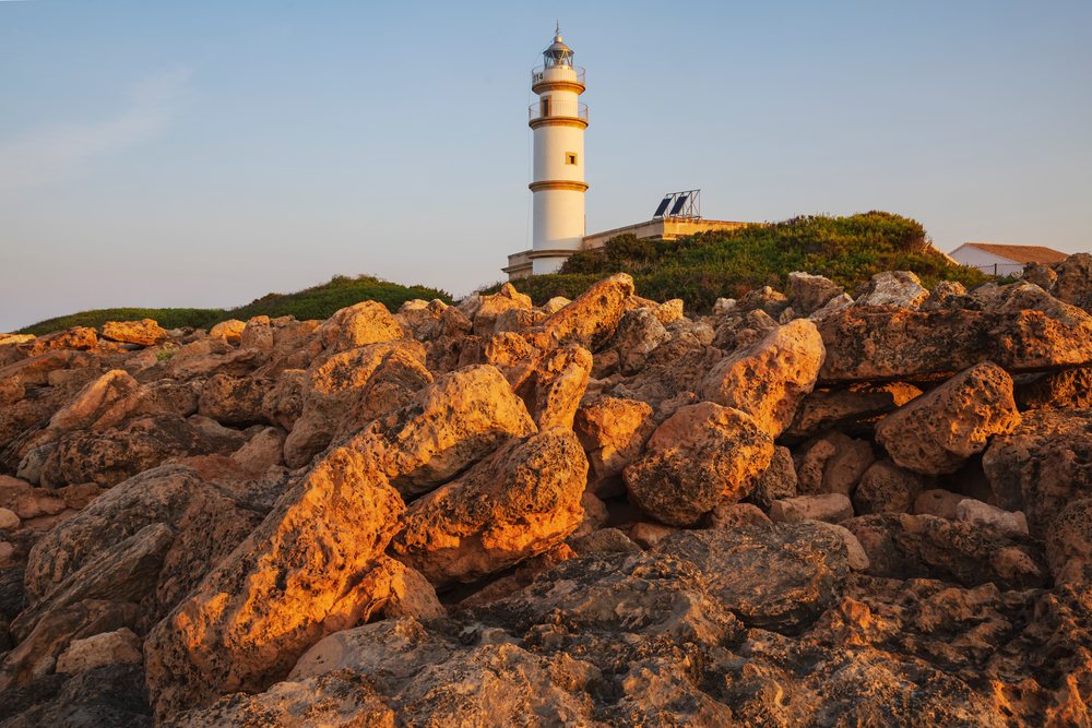 Lighthouse on rocky coastline, Landscape, Lifestyle, Cabo de las Salinas, Mallorca, Spain.