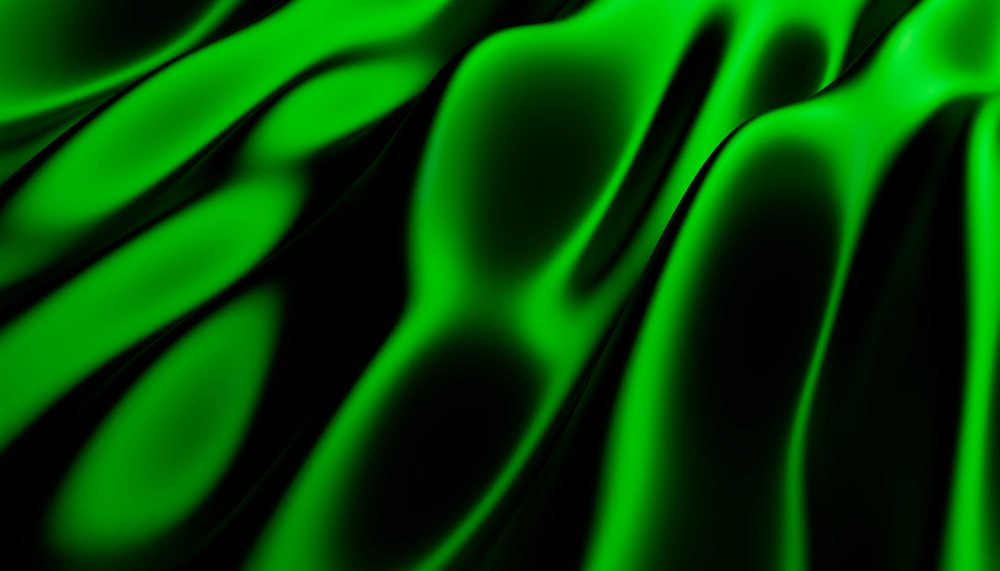 green silk fabric with smooth shiny folds and draping texture.