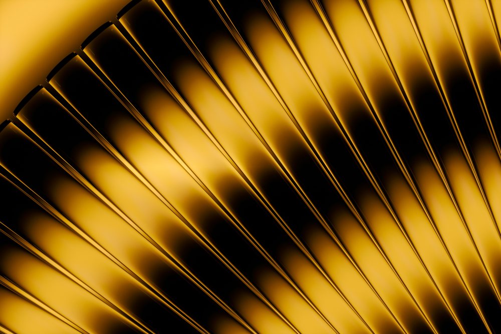 Symmetrical golden metallic fan blades form an abstract reflective pattern with smooth texture and decorative design.