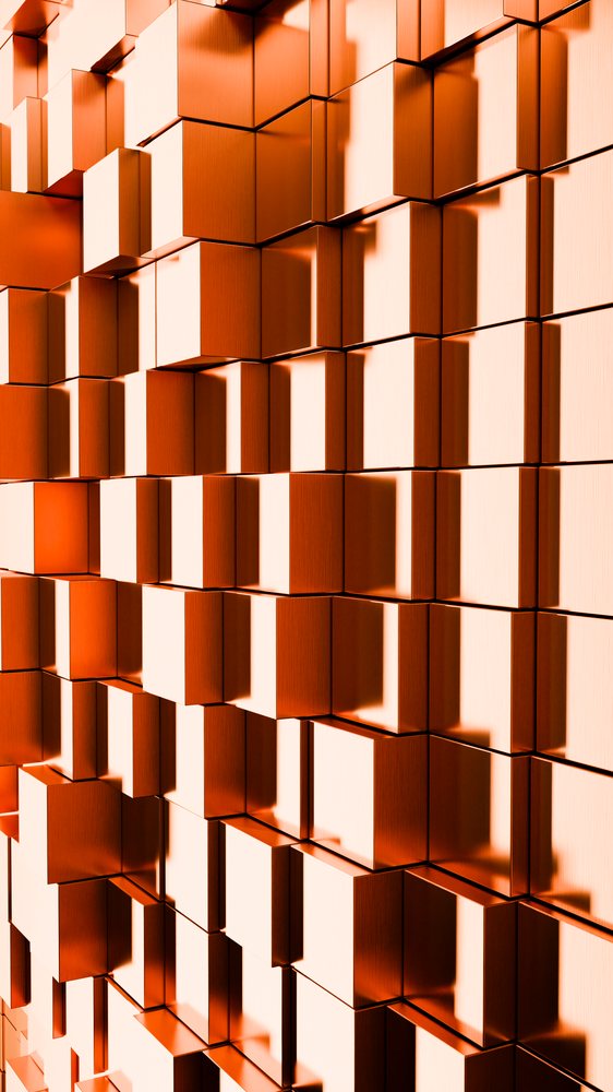 Orange 3D cubes stacked in a geometric pattern casting sharp shadows in a digital abstract design.