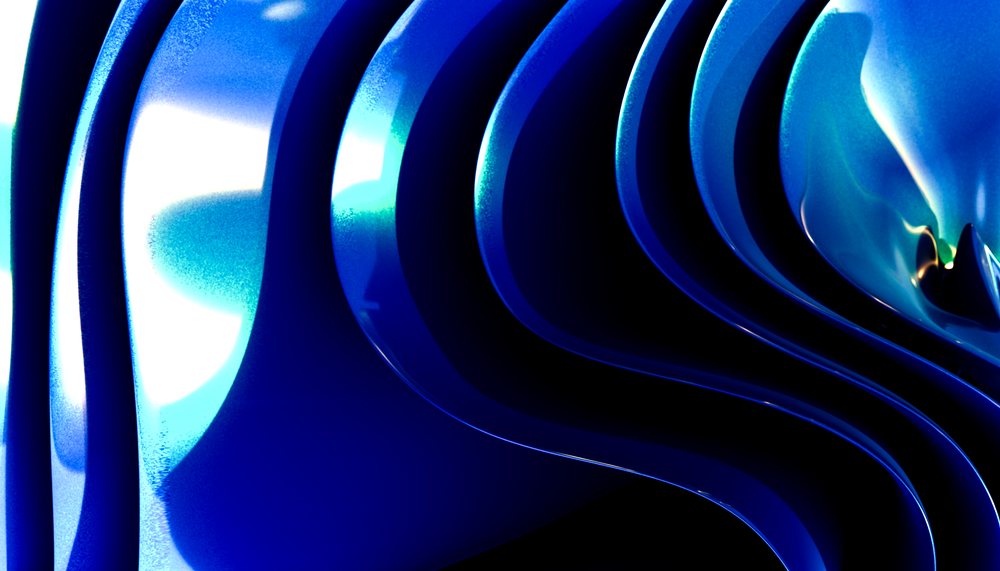 Blue abstract artwork featuring shiny curved surfaces and flowing wave-like shapes in a digital composition.