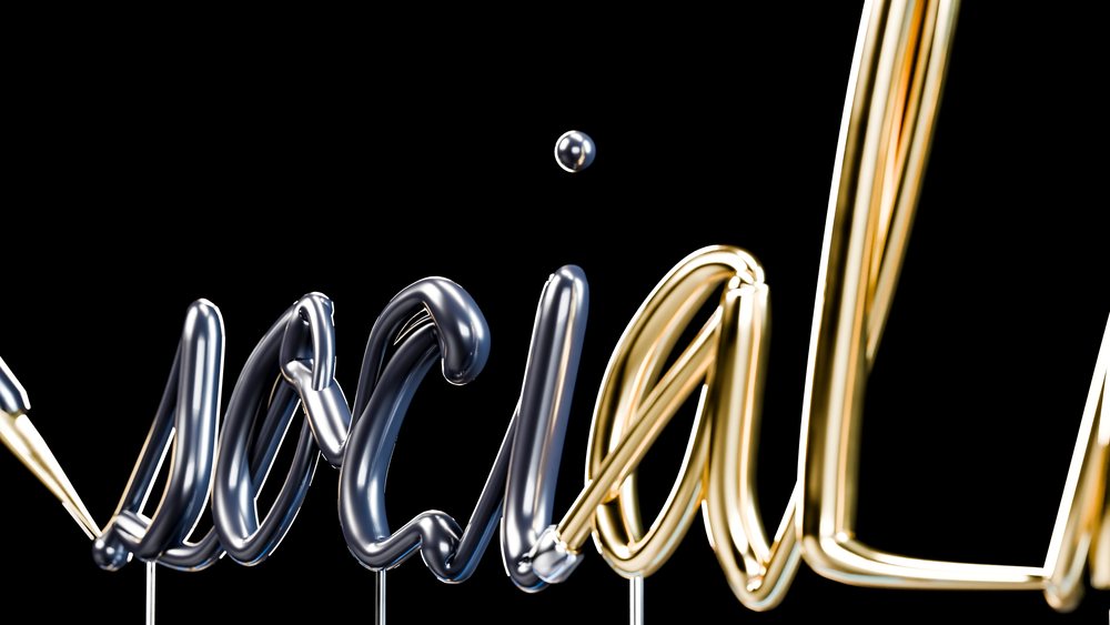 Metallic silver and gold 3D letters spelling 'metal' float and stand vertically on thin rods against a black background.