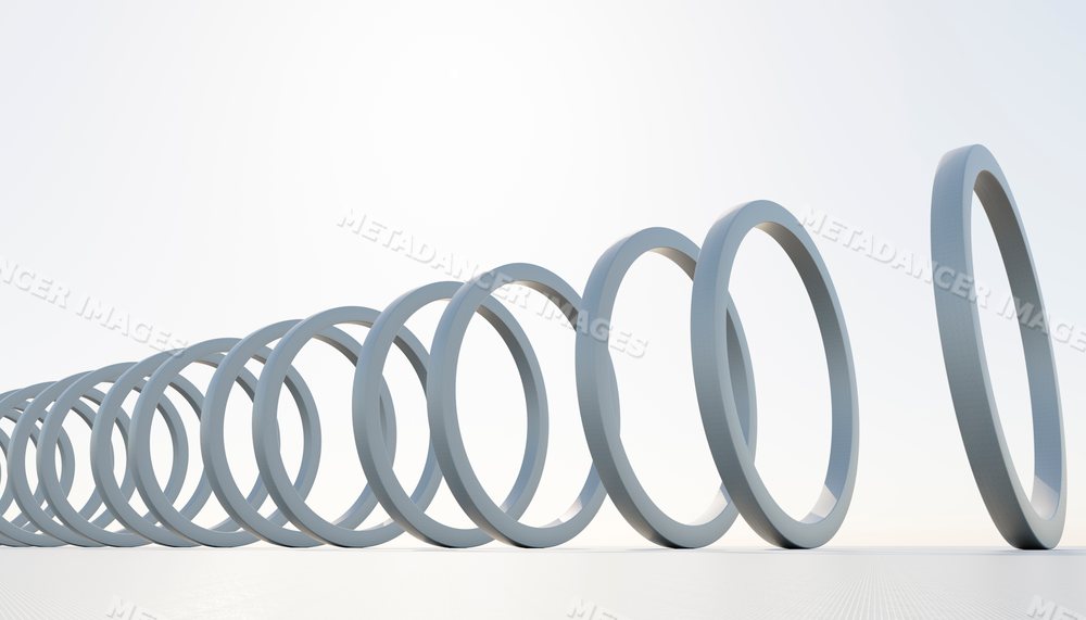 White rings arranged in a falling domino effect on a plain white