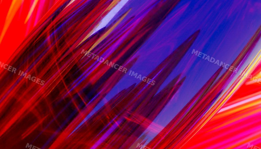 Close-up abstract colorful glass with vibrant red and purple