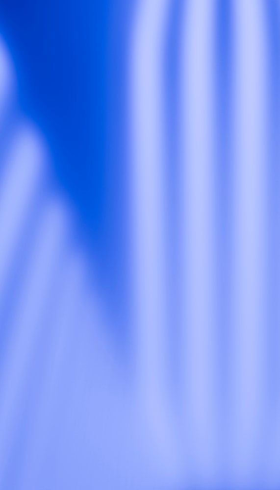 Abstract blue gradient background with soft light streaks and vertical blurred stripes.