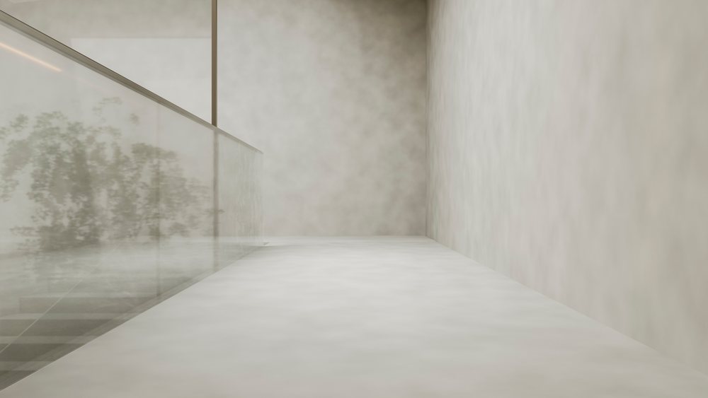 Empty modern corridor with concrete walls and glass railing.