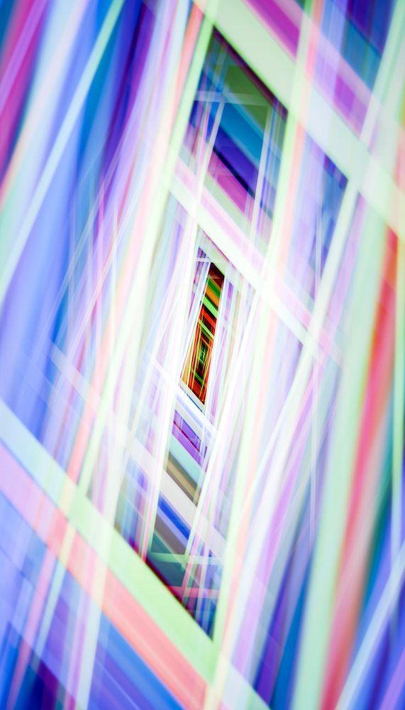 Symmetrical abstract geometric pattern with layered bright shapes and overlapping lines in a vibrant digital composition.