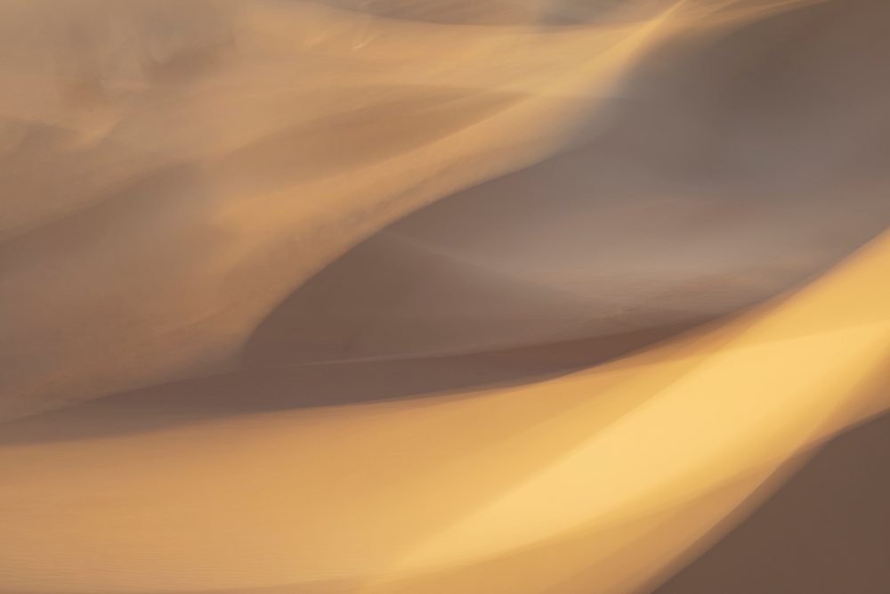 Sand dunes at Erg Lehoudi, captured with intentional movement creating smooth patterns, Lifestyle, Landscape, Culture, M'Hamid, Zagora Province, Morocco.